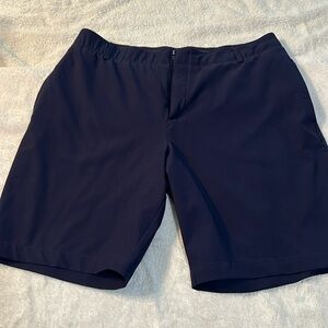 Navy Under Armour golf shorts. Worn once. Size 14.